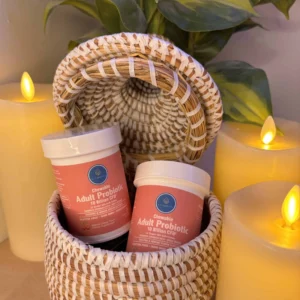 a basket with two containers and candles